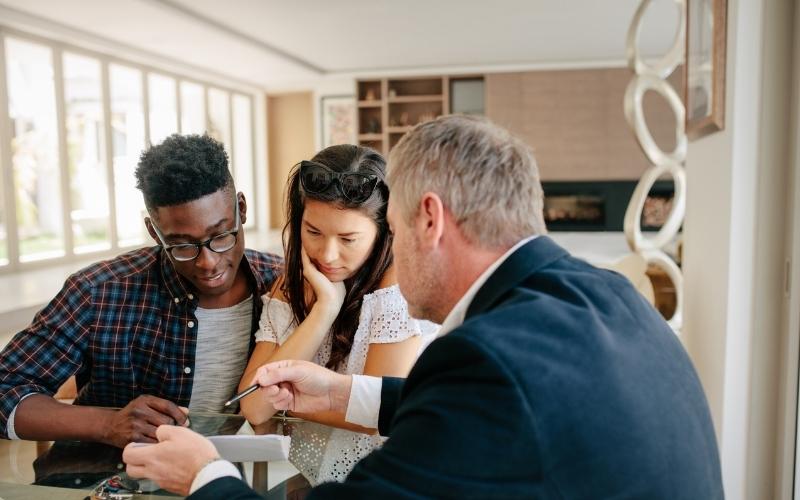 couple reviewing new underwriting process with a mortgage lender